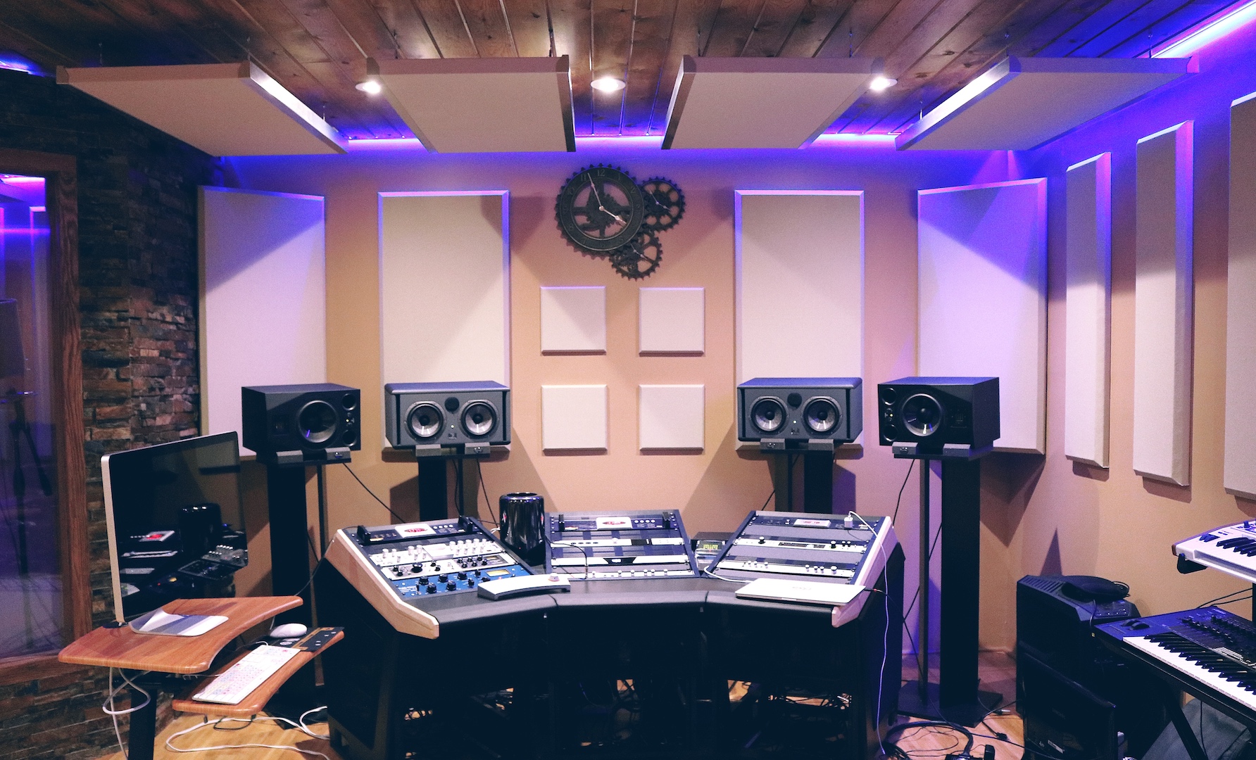 Studio control room with acoustic panel treatment on walls and ceiling